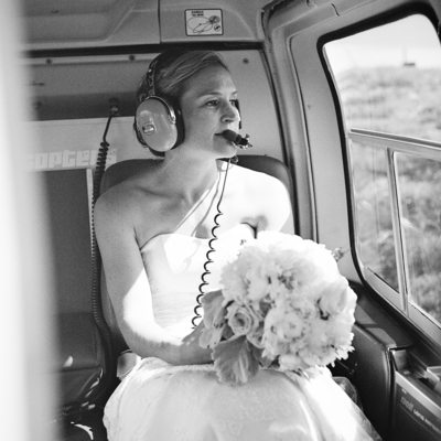 bride with earphones in helicopter during flight