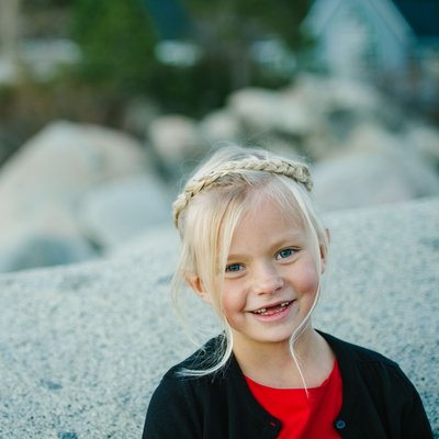Blond girl toothless smile in Lake Tahoe
