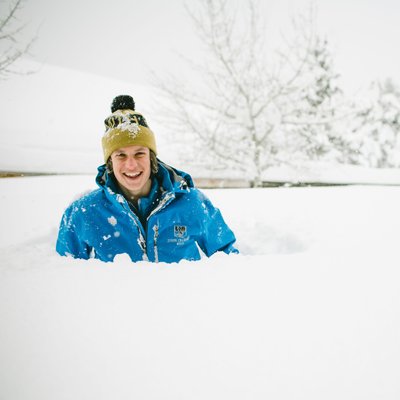 Teenager in chest deep snow in Lake Tahoe