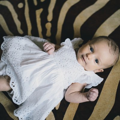 Baby girl on zebra rug in lahontan