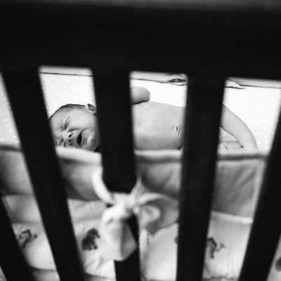 Newborn in crib
