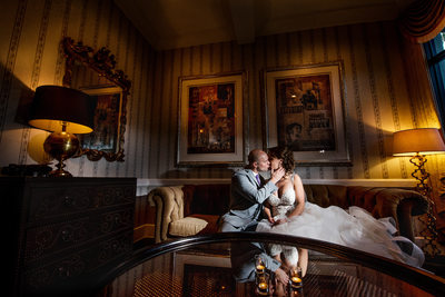 couple kiss ornate lounge longboat key wedding