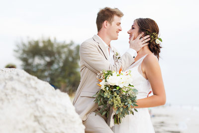 couple look lovingly into eyes florida island wedding