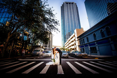 groom dips bride kiss pedestrian crossing tampa