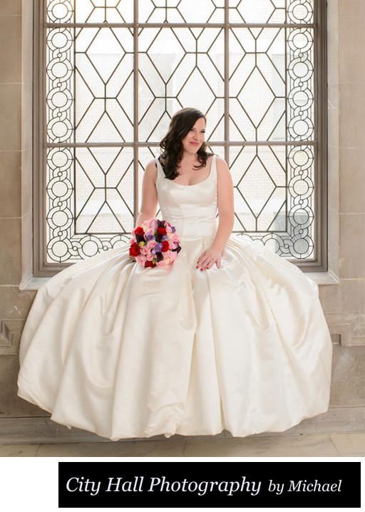 Looking at groom while sitting in SF City Hall Window