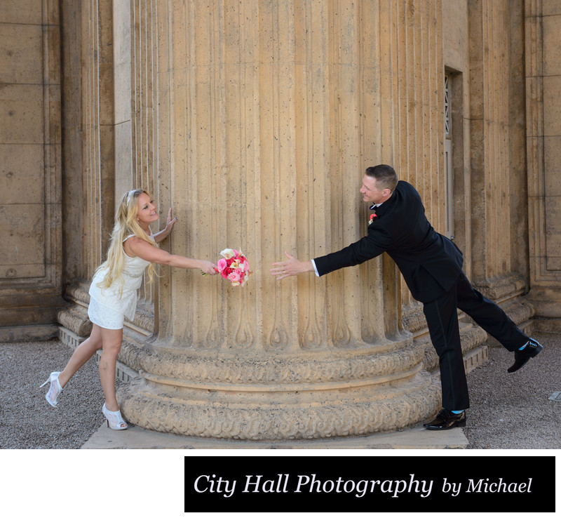 Reach for wedding bouquet at the Palace of Fine Arts in San Francisco