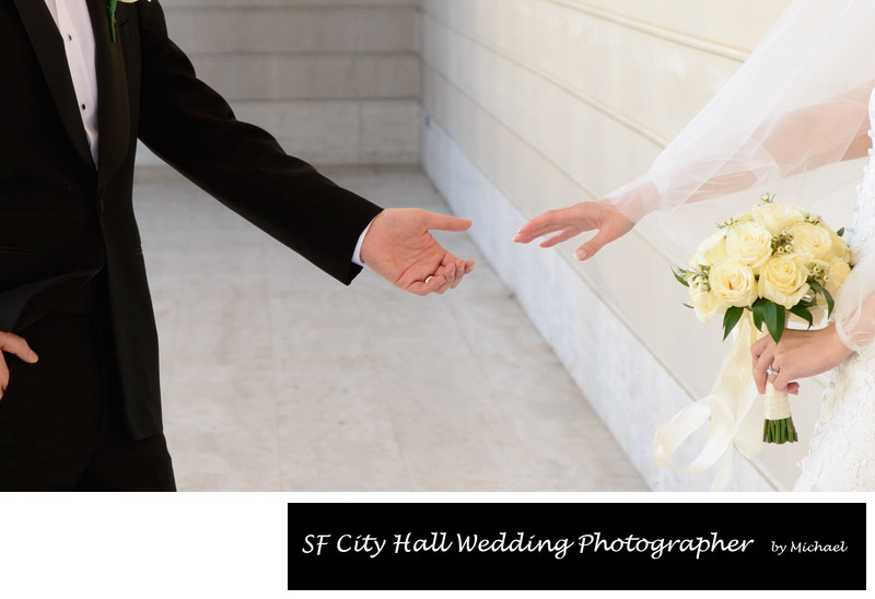 Bride and Groom holding hands at the Legion of Honor