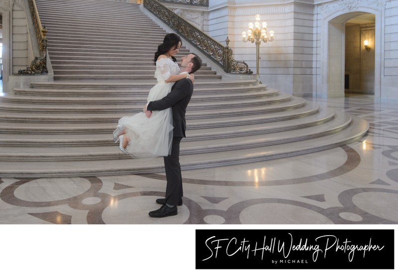 Panoramic Image in 16X19 ratio of the Grand Staircase with Groom lifting Bride.