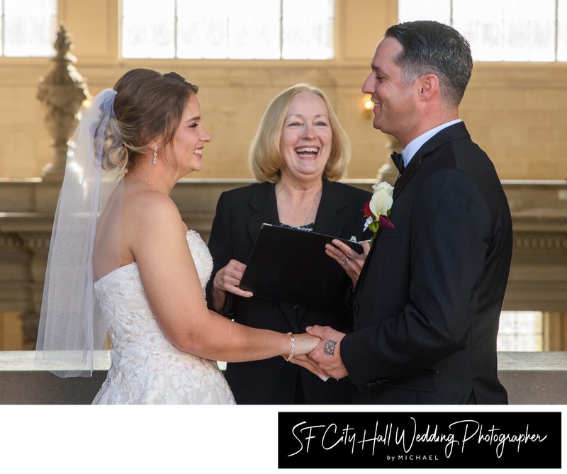 Fun Moment during San Francisco city hall Nuptials - bride and groom laugh