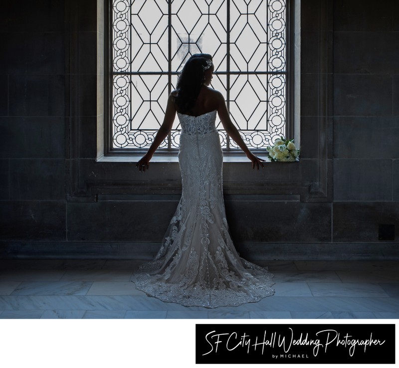 Dramatic Bride in front of SF city hall window - wedding photography