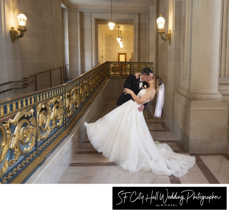 Wedding photography kiss with dance dip at city hall