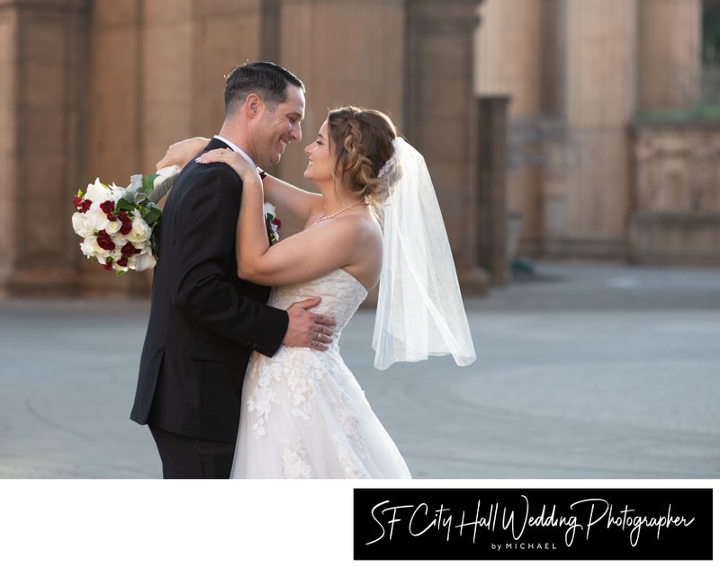 Happy Newlyweds posing at the Palace of Fine Arts in San Francisco