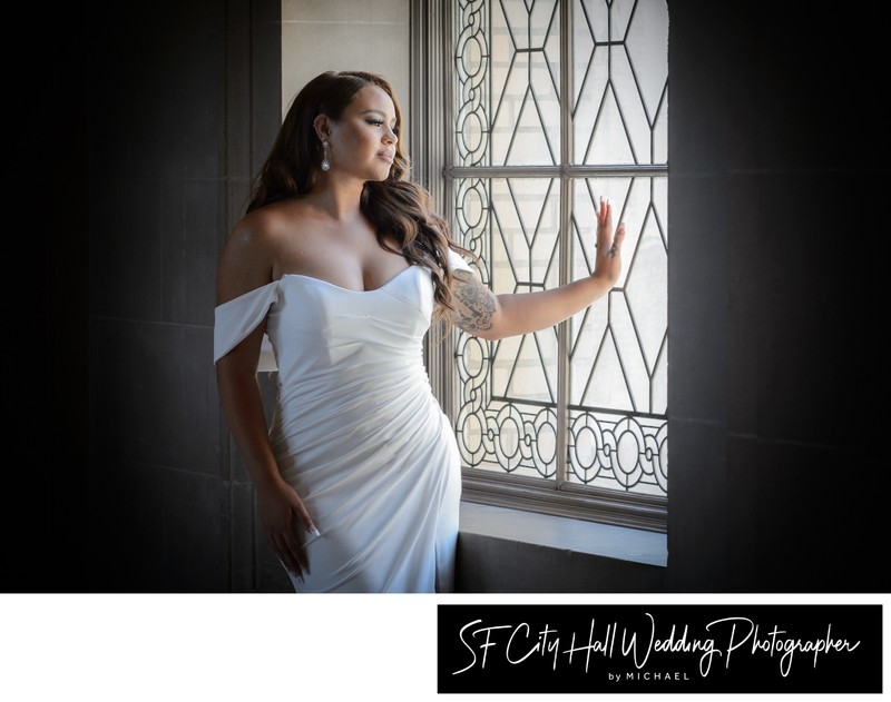 San Francisco  City Hall bride gazing out window on 3rd Floor