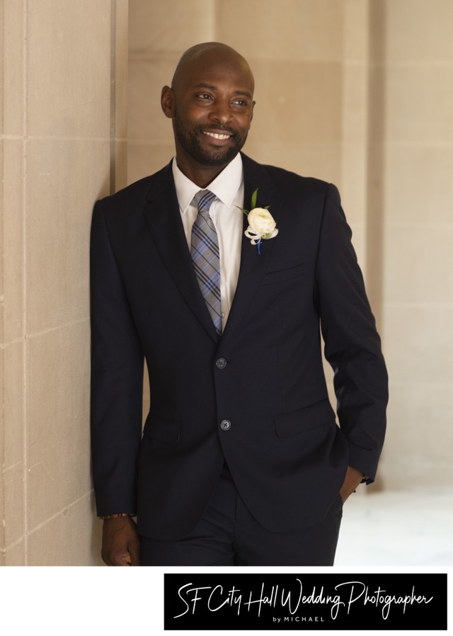 SF City Hall groom looking handsome as he poses for the camera