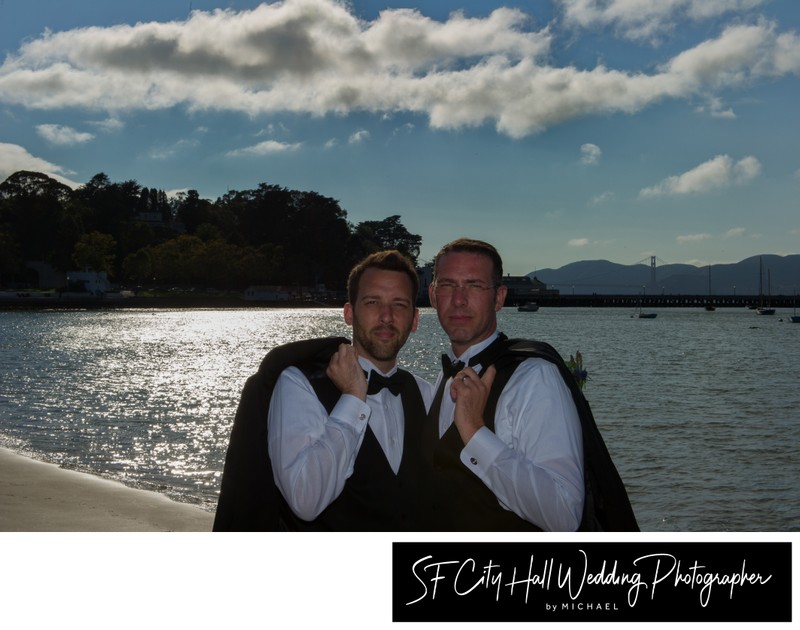 Gay San Francisco city hall grooms hang out at Ghirardelli Square near the water.