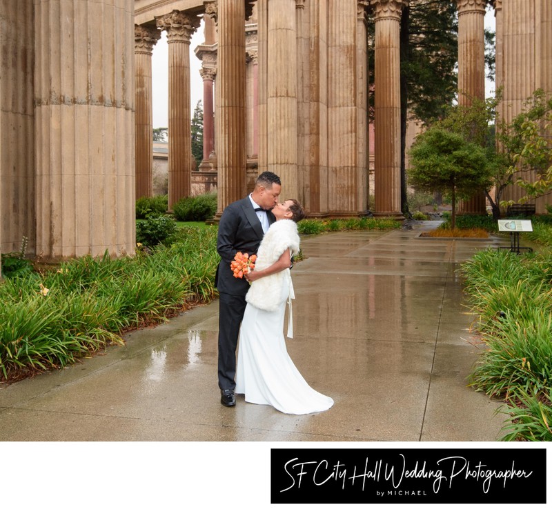 African-American city hall couple at the Palace of Fine Arts in the rain