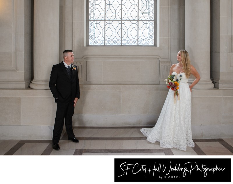 Newlyweds pose on the second floor at SF City Hall - wedding photography