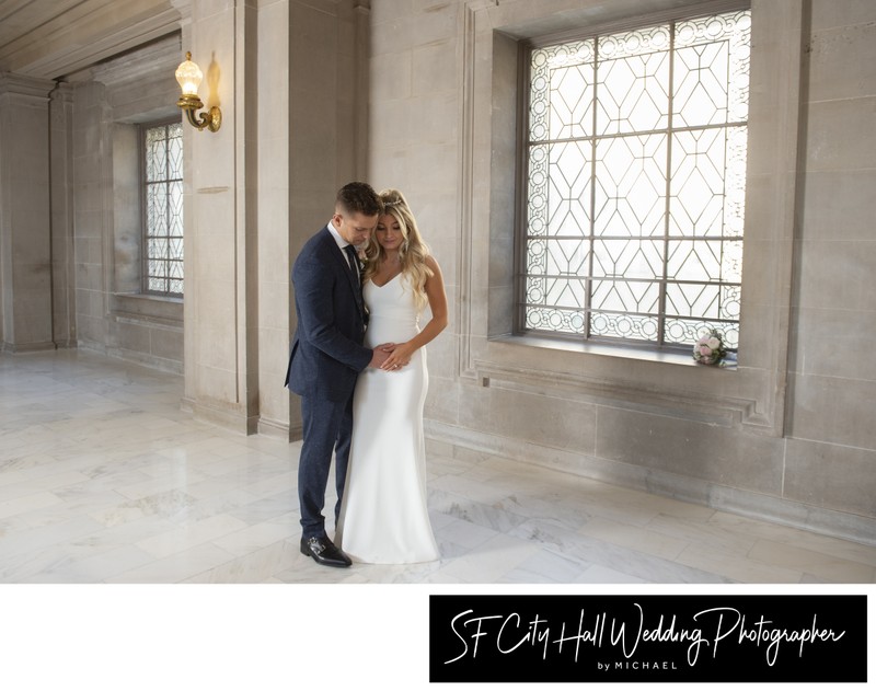 Bride and groom take a moment by 3rd Floor window