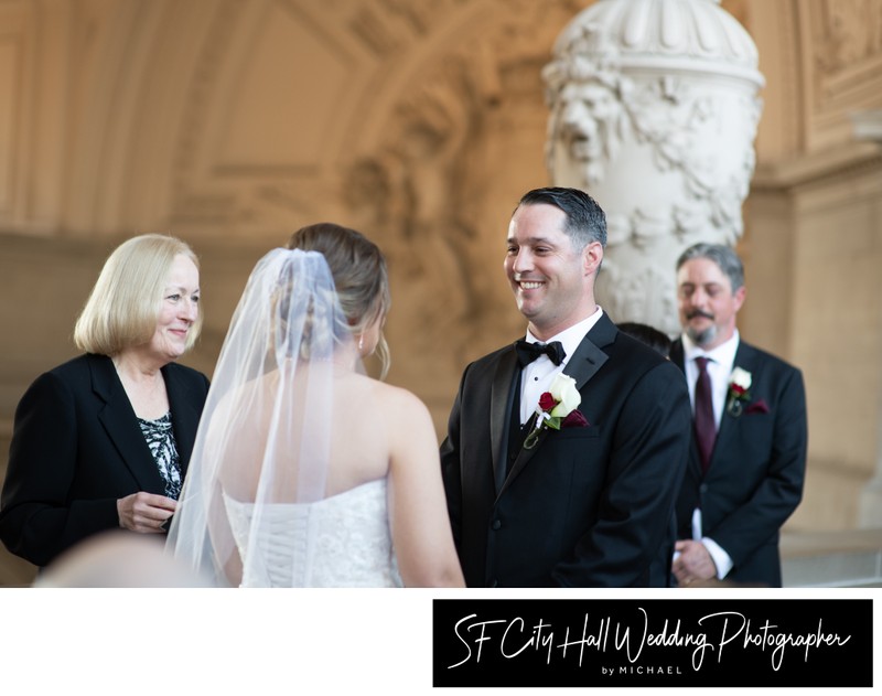 Groom looking at his bride with love during their city hall nuptials