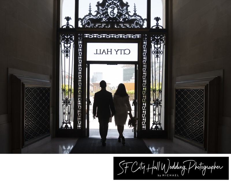 Bride and groom leaving San Francisco city hall 