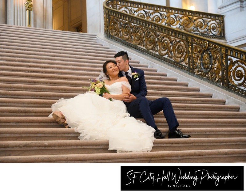 Bride and Groom sitting together on the Grand Staircase