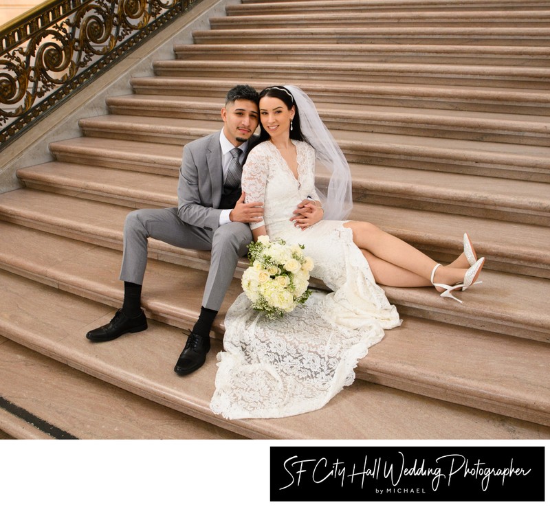 Latino Couple sitting on the Grand Staircase at SF City hall