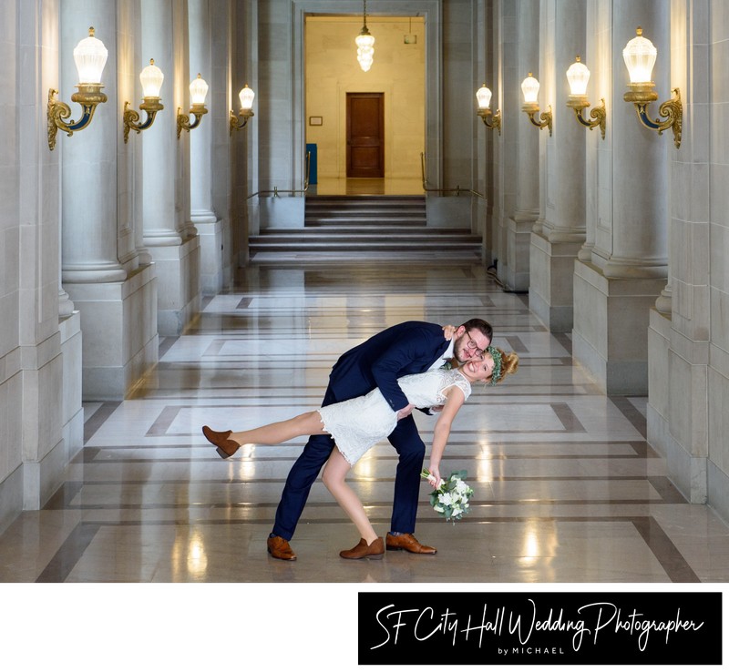 SF City Hall Eloping Couple dance dip after their wedding