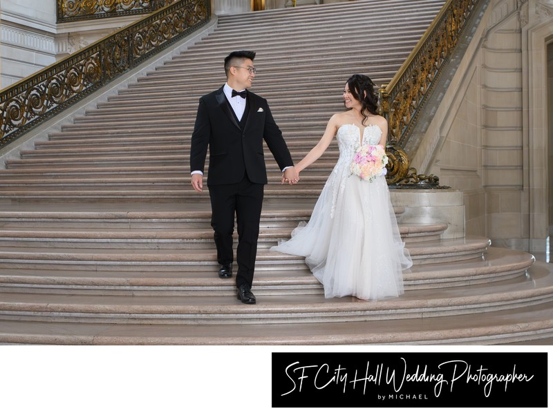 SF City Hall Newlyweds walking down the Grand Staircase