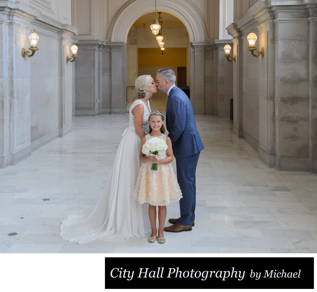 Best Kiss over daughter - San Francisco City Hall Wedding Photographer