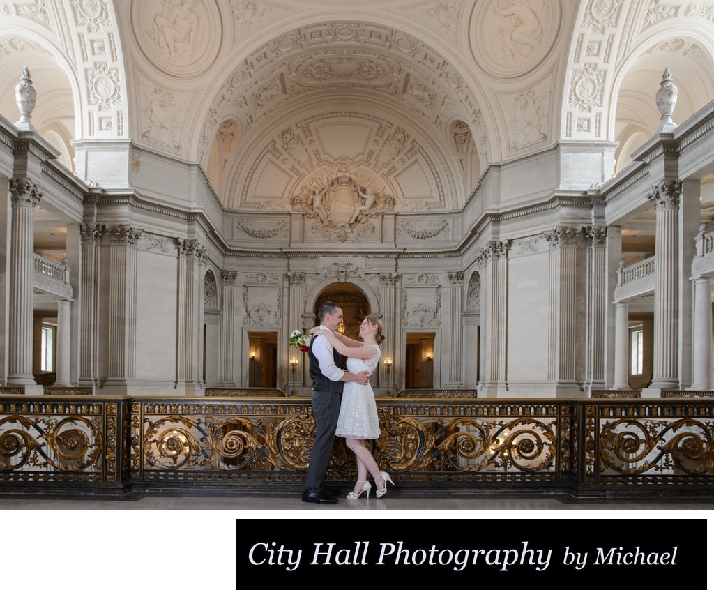 Bride and Groom posed on the Mayors Balcony City Hall
