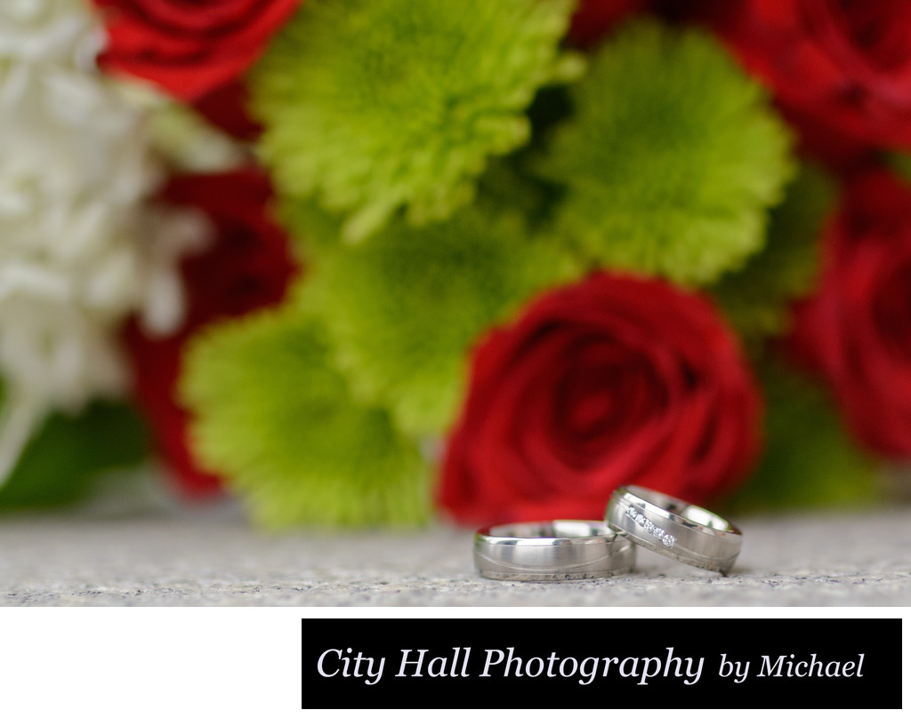 Wedding rings flower bouquet close up photo