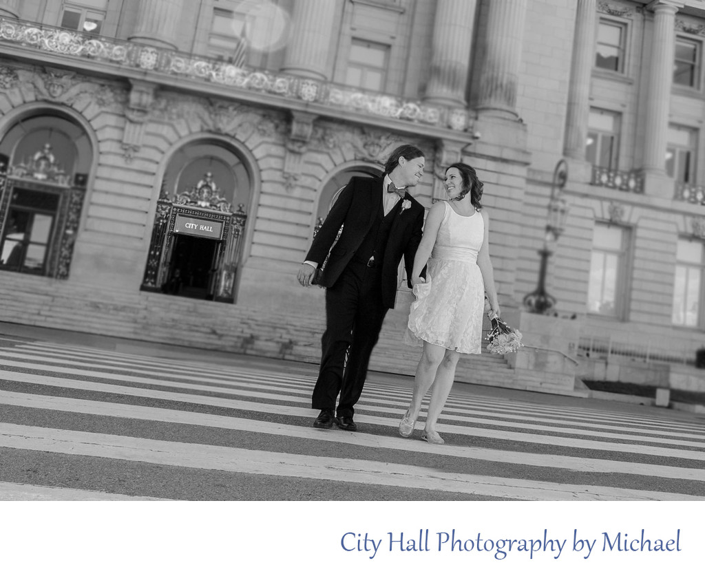 Married Couple walks away from San Francisco City Hall Wedding