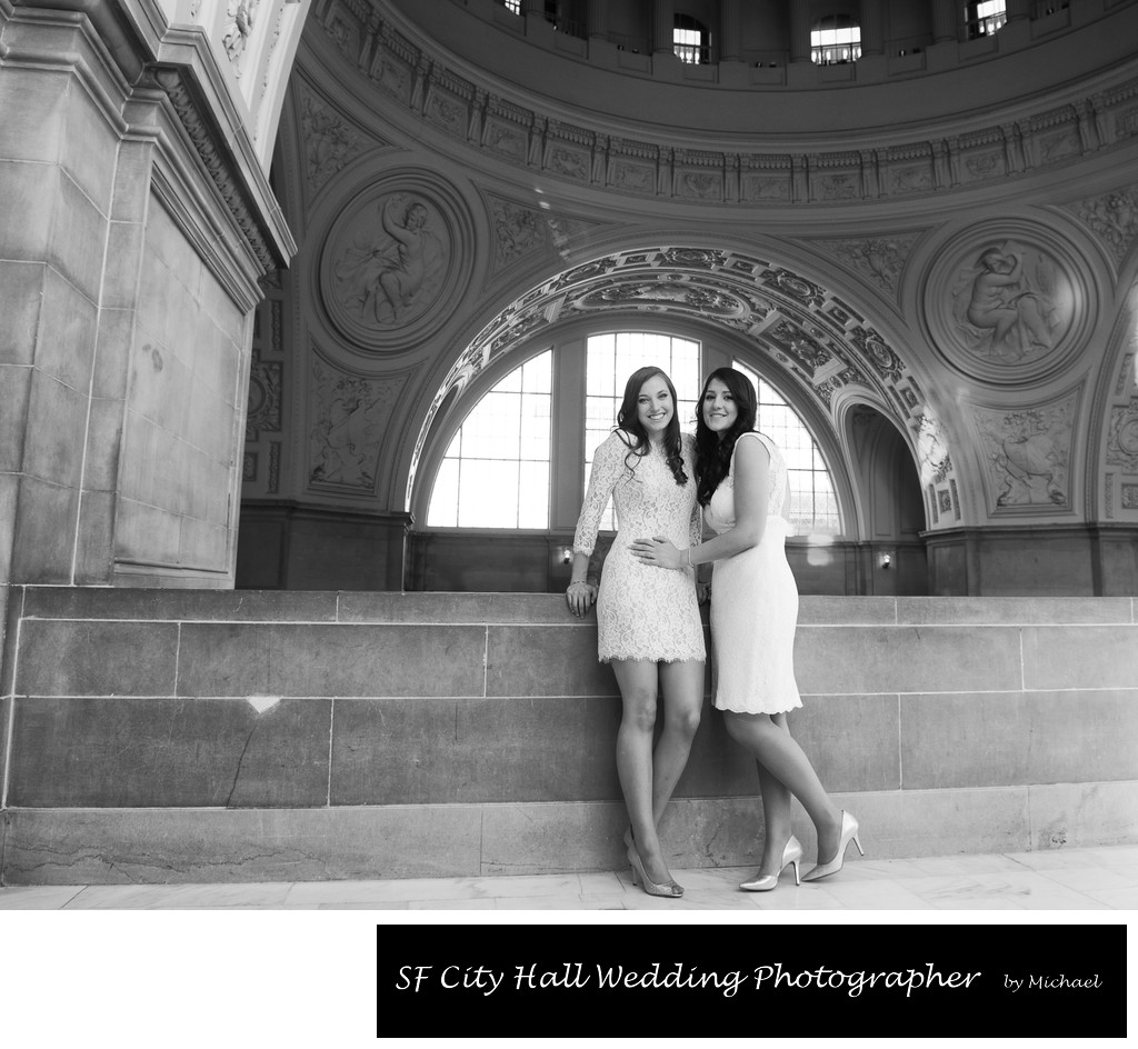 Lesbian brides at San Francisco city hall posing for wedding photos