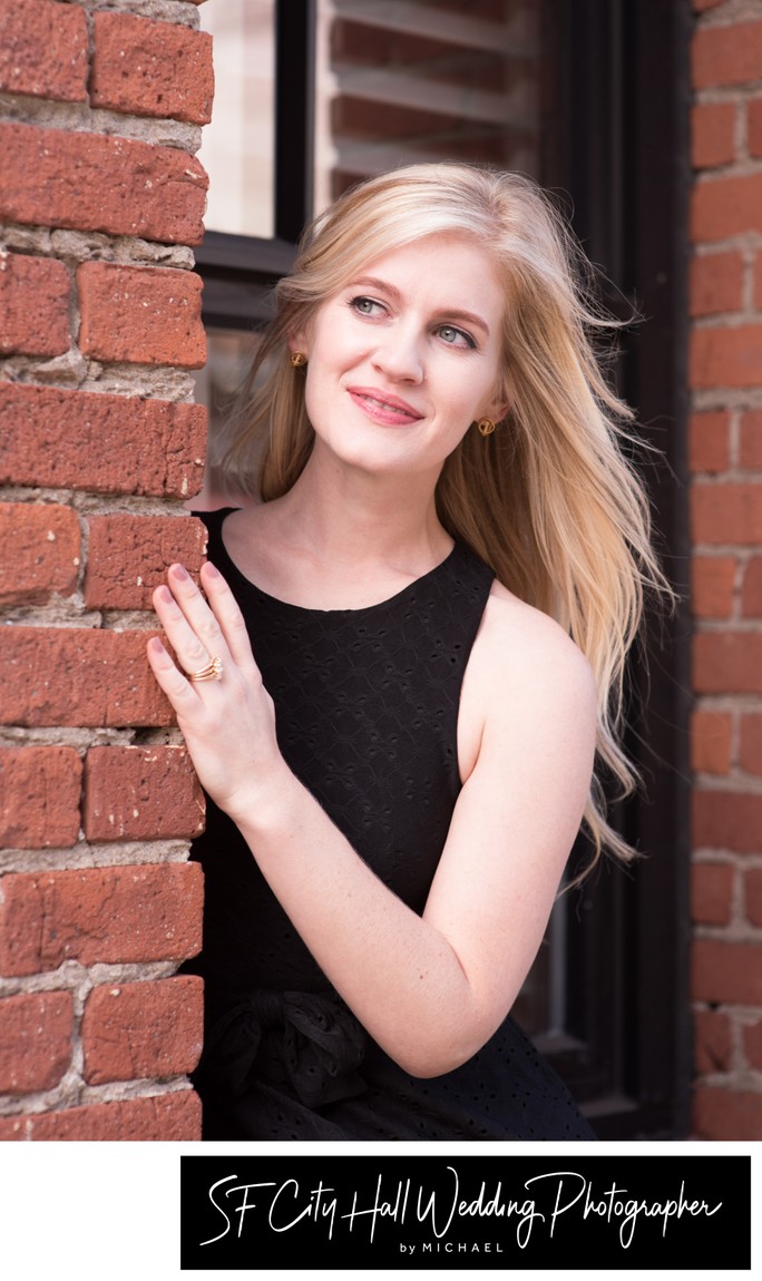 Engagement portrait of future City Hall bride at Ghirardelli Square