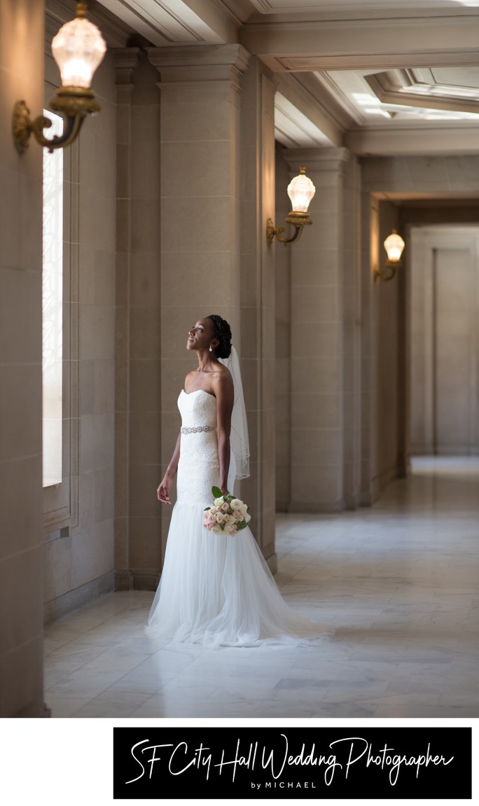 San Francisco city hall wedding photography, bride looking out window