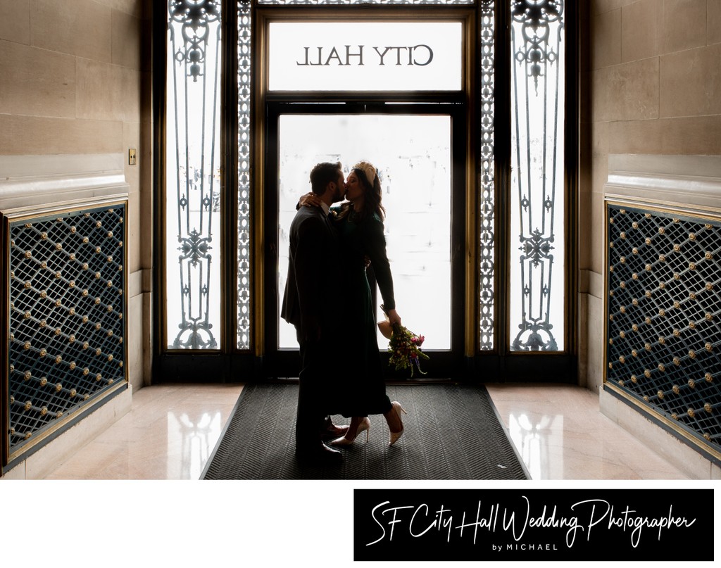 Silhouette image of newlyweds leaving San Francisco city hall