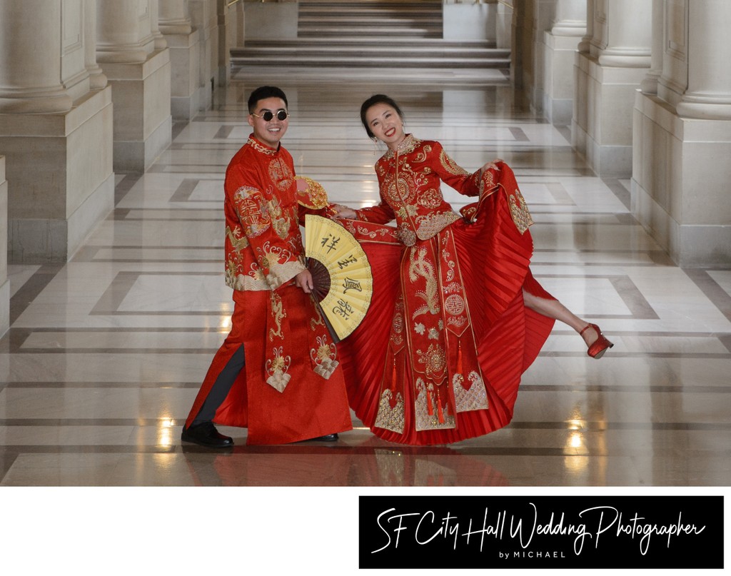 Fun Asian Couple posing for San Francisco city hall wedding photography