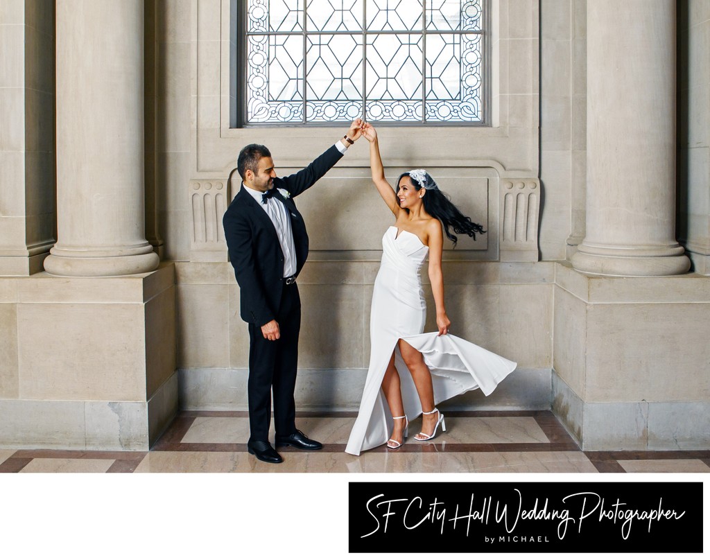 Groom Twirling Bride at SF City Hall - Wedding Photography