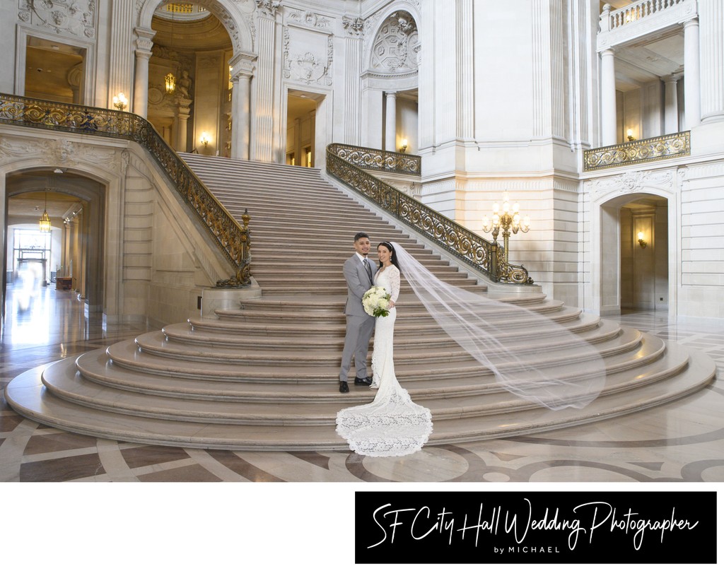 Brides veil floating in air on the Grand Staircase at SF City Hall