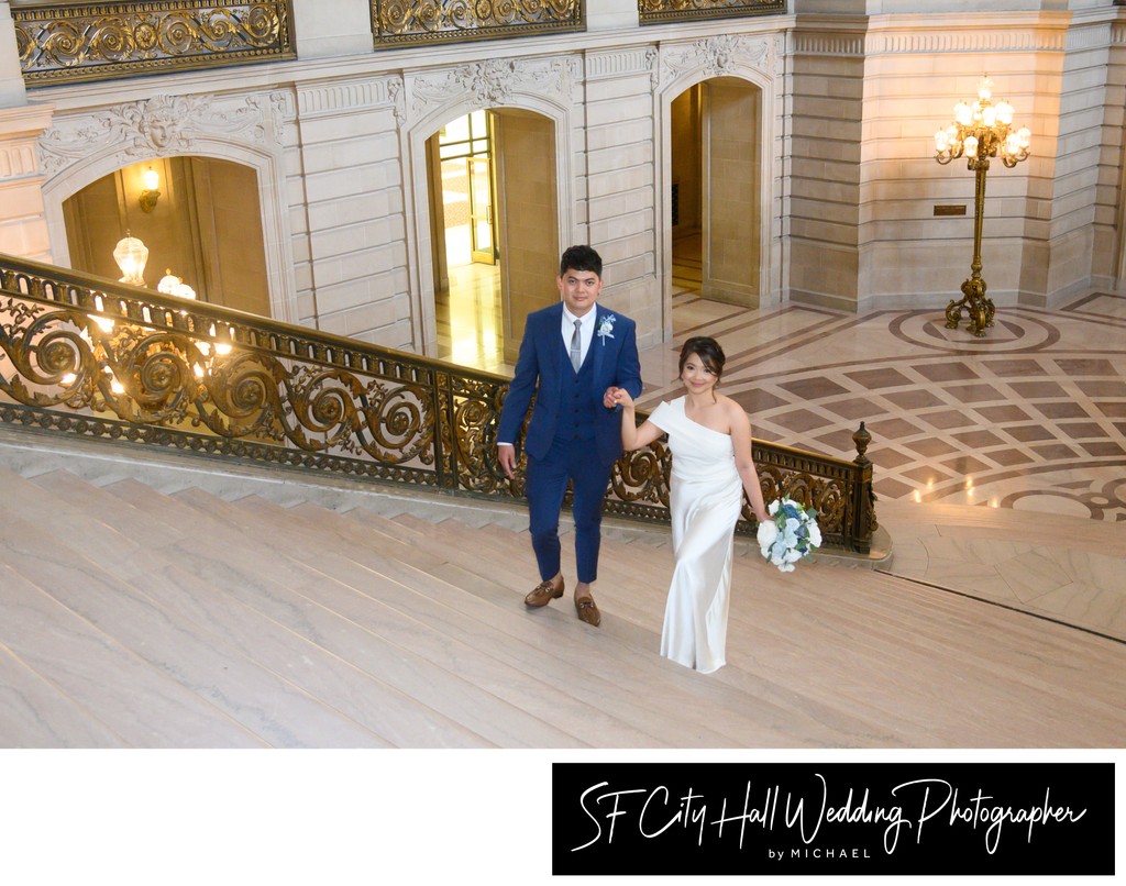 City Hall bride and groom heading up stairs to get married at city hall