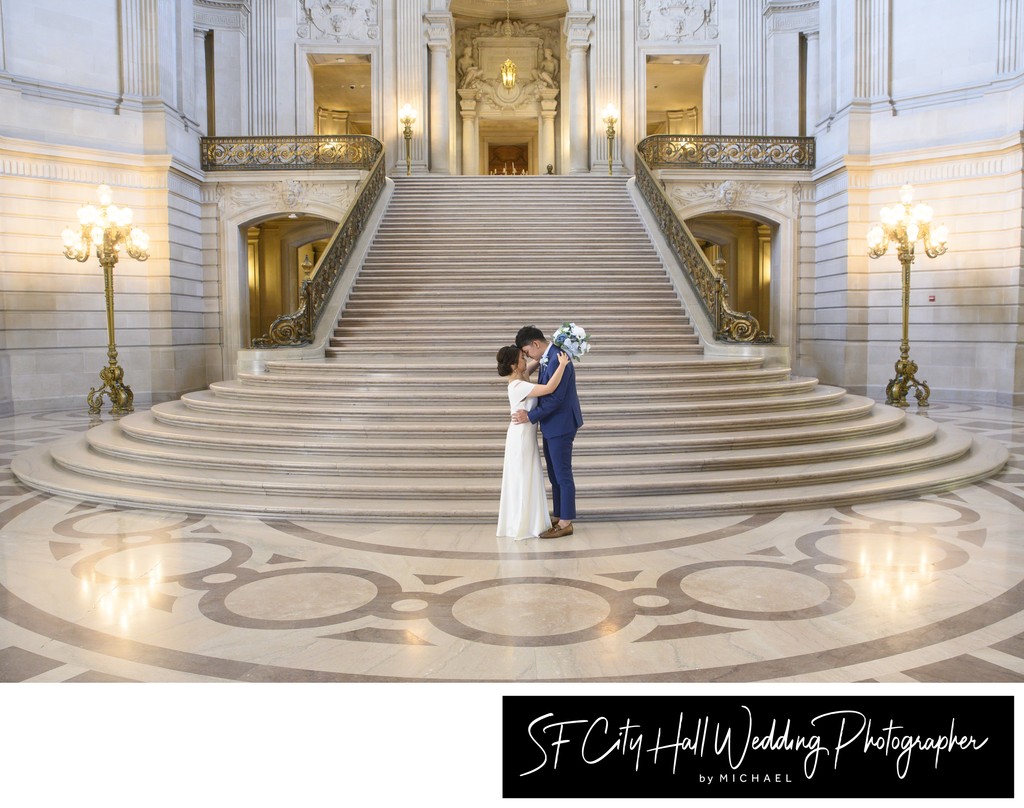 Romantic wedding photographer at City Hall - Newlyweds hugging