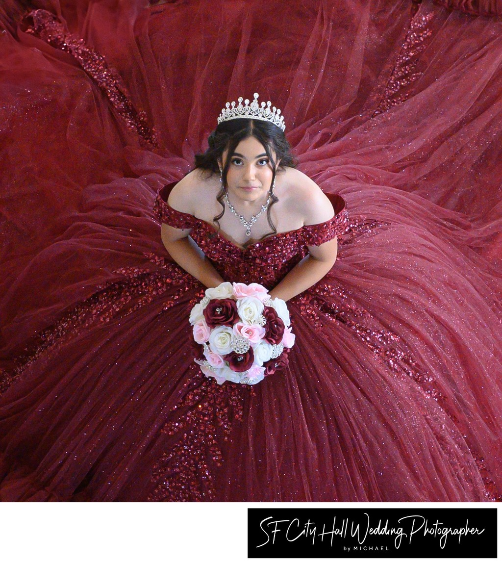 Headshot of Quinceanera surrounded by her dress - SF City Hall