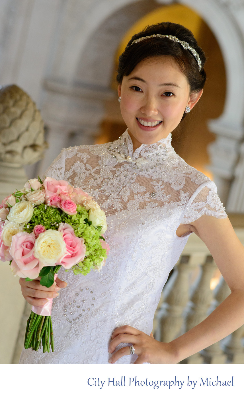 Wedding Photographer San Francisco City Hall - Asian Bride  posing while holding a Bouquet