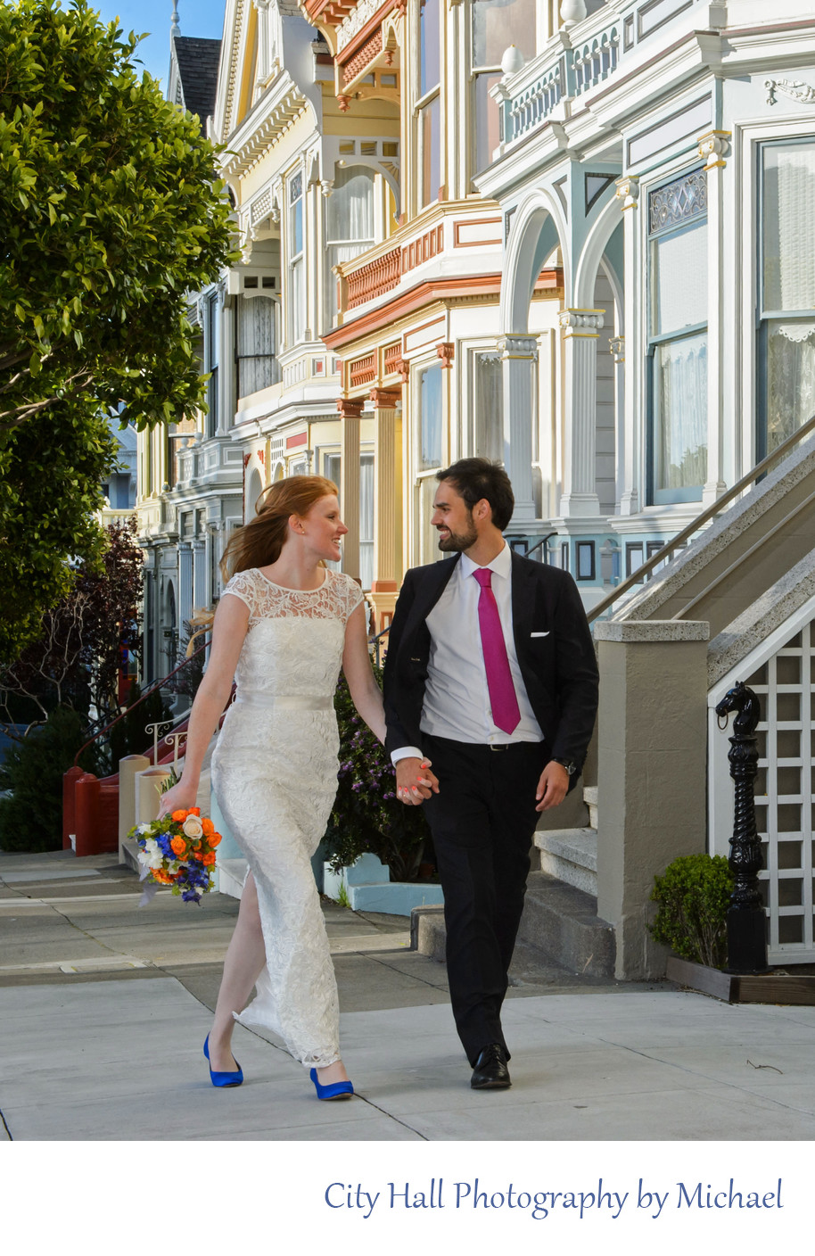 Photojournalist Wedding Photos Walking by the  Painted Ladies after city hall