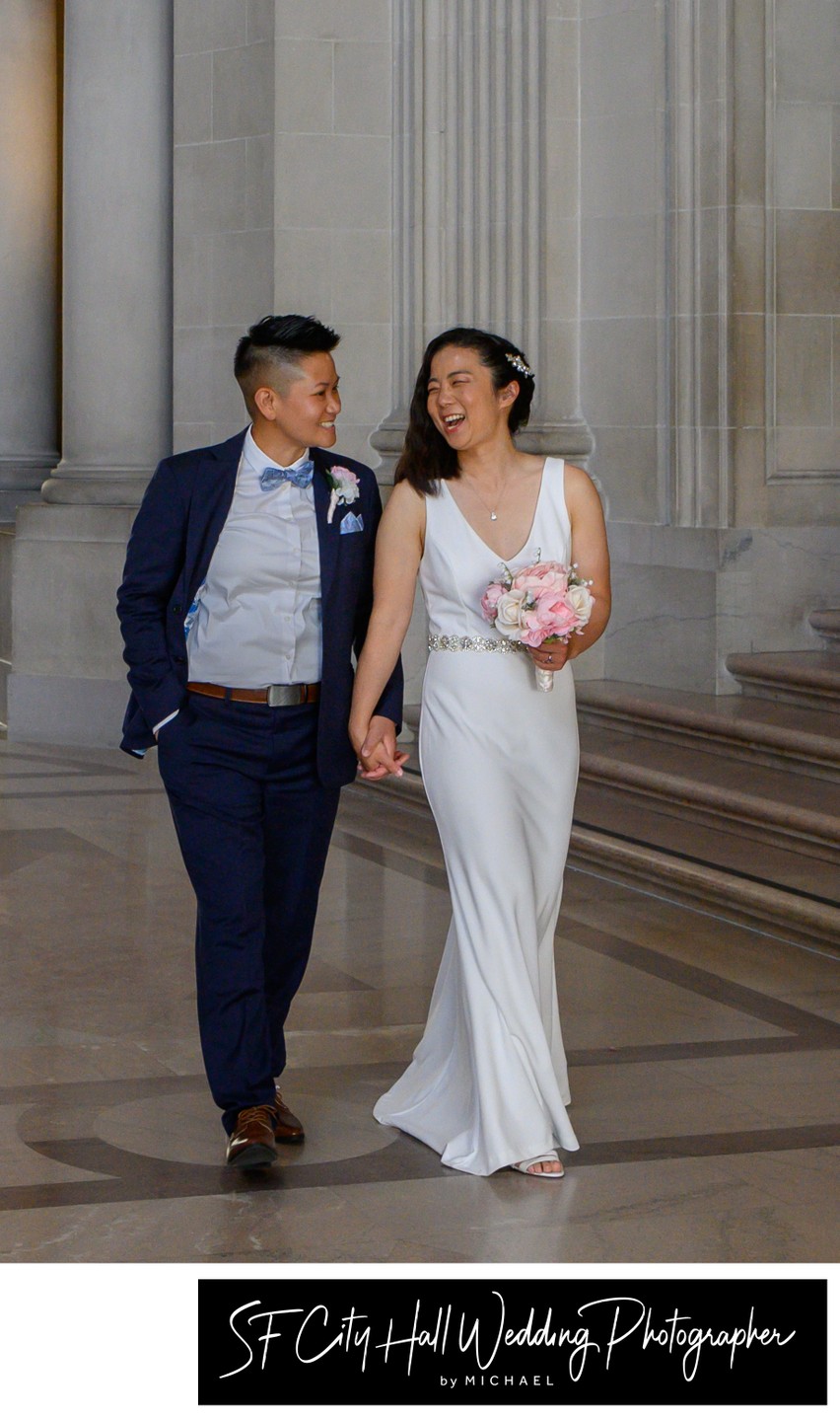 Bride and bride walk at City Hall