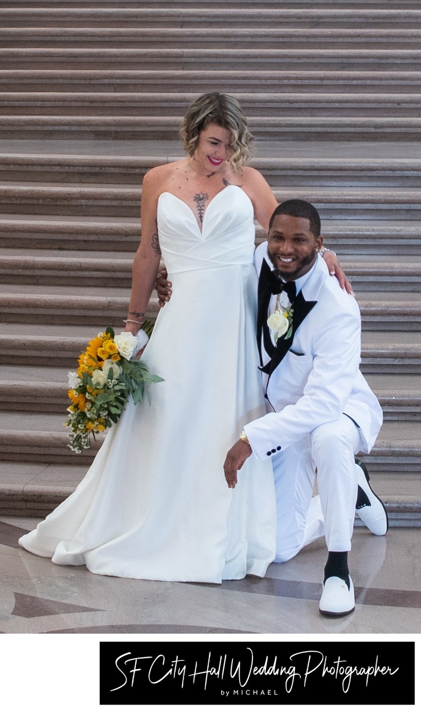 SF City Hall bride and groom enjoying the Grand Staircase