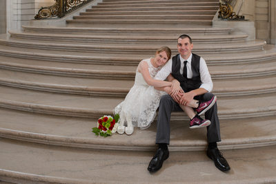 San Francisco City Hall Wedding Photographer - Couple Sitting on Staircase