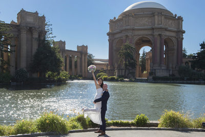 Wedding Photographers San Francisco City Hall - Groom lifting Bride
