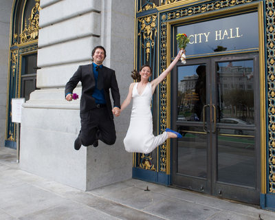Jumping Married Couple Happy To have Completed Ceremony