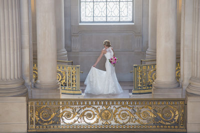 SF City Hall Bride checks wedding gown with Bouquet